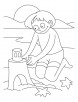 A boy making castle with sand on the beach coloring pages