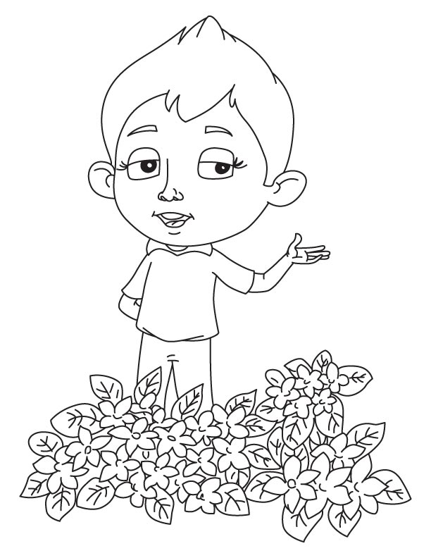 Boy standing at jasmine vine